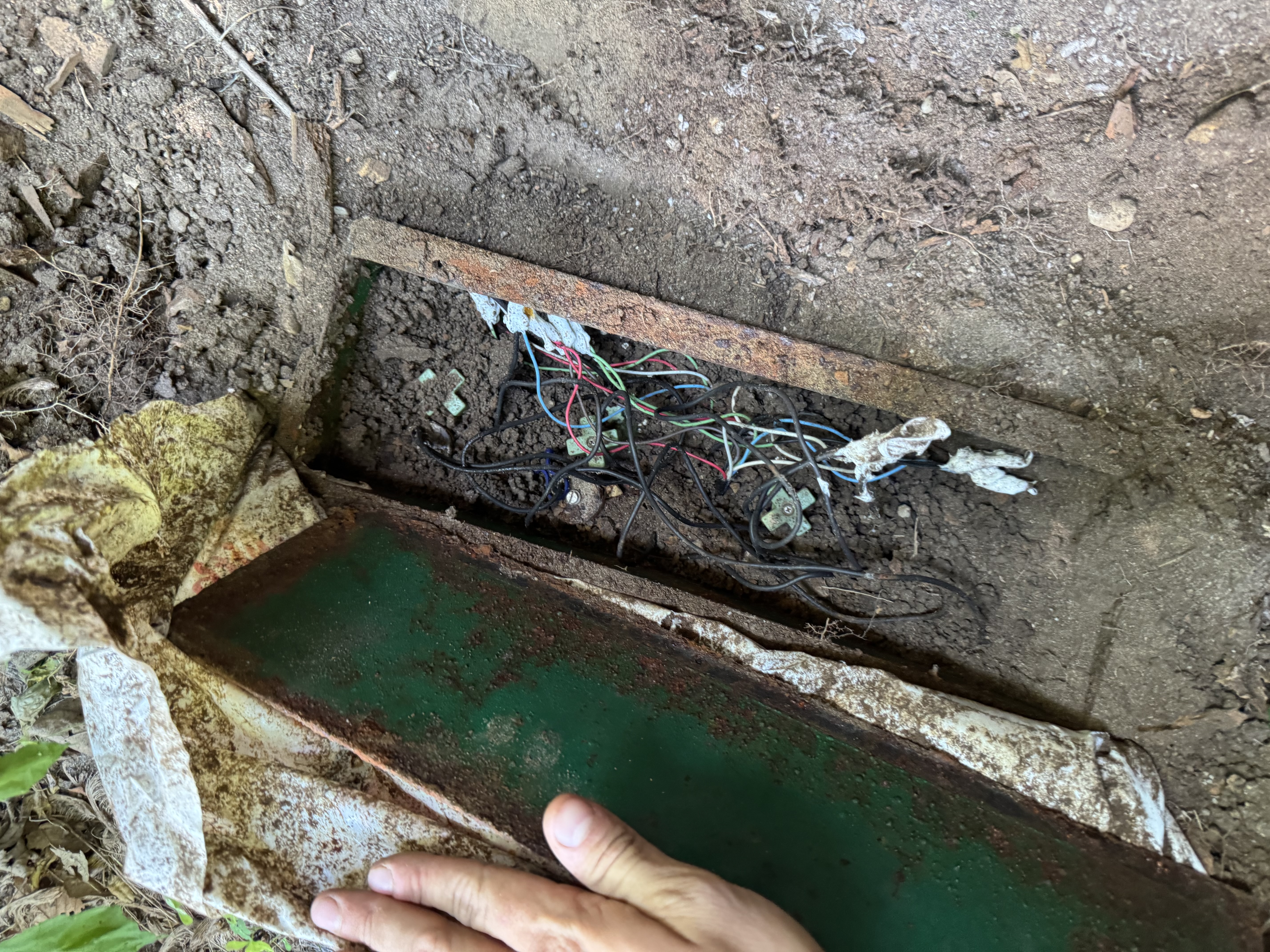 Before project image for Shelby Township Sprinkler System Revamp: Complete 9-Valve Manifold Replacement, Wire Tracking & Irrigation Repair